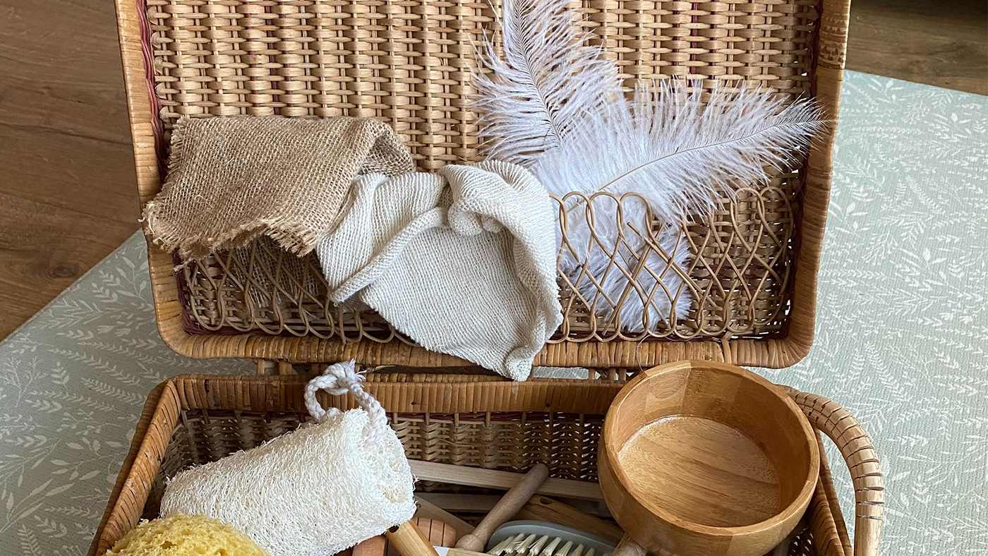 Time to explore – this basket is full of interesting items to touch and play with - Featured Image