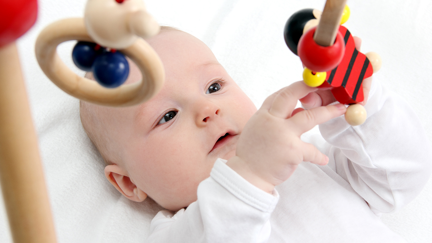 Baby workout – holding toys above your baby to encourage them to look - Featured Image