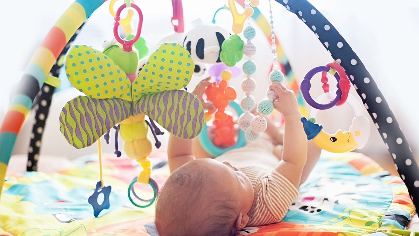 Watch it move – hanging toys above your baby so they can see how their hands can make toys move - Featured Image