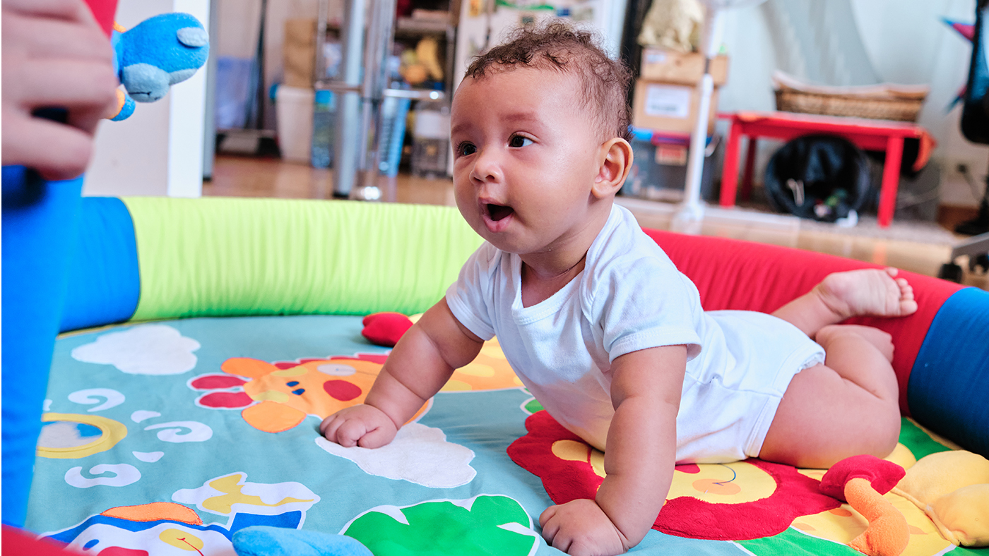 Mutual tummy time – join in so your baby can see your face - Featured Image