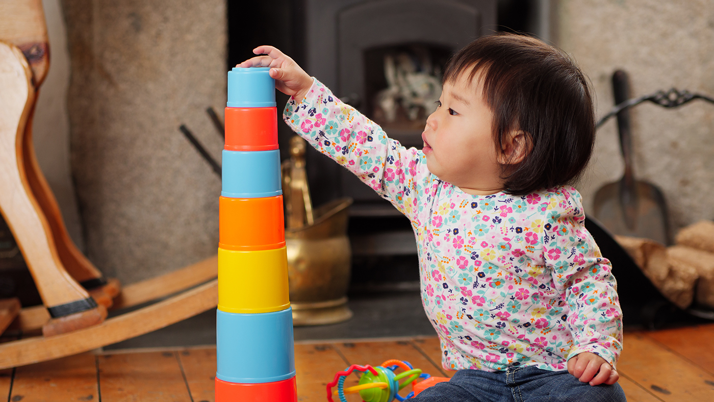 Moving and possibly stacking – exploring and investigating the parts of stacking toys - Featured Image