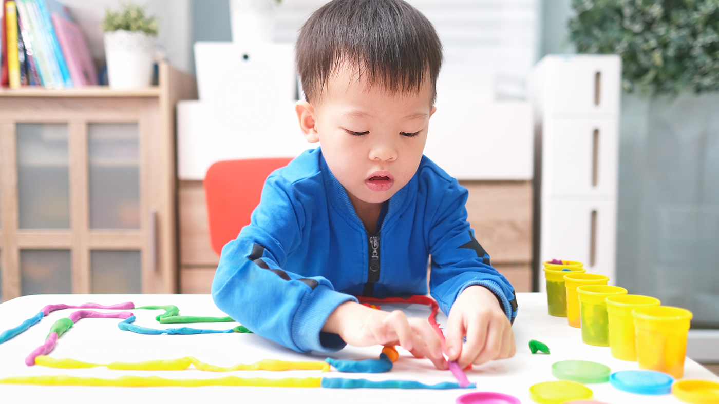 Manipulates clay or playdough with hands to make a ball or snake - Featured Image