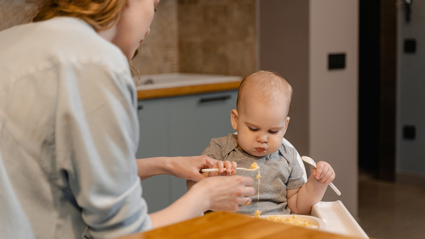 Holds a spoon and brings it to their mouth - Featured Image