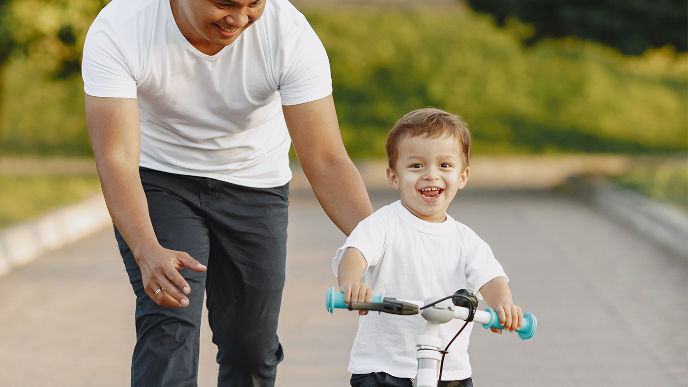 Finding it hard to get moving on a bike? Five simple steps to help your child ride independently - Featured Image