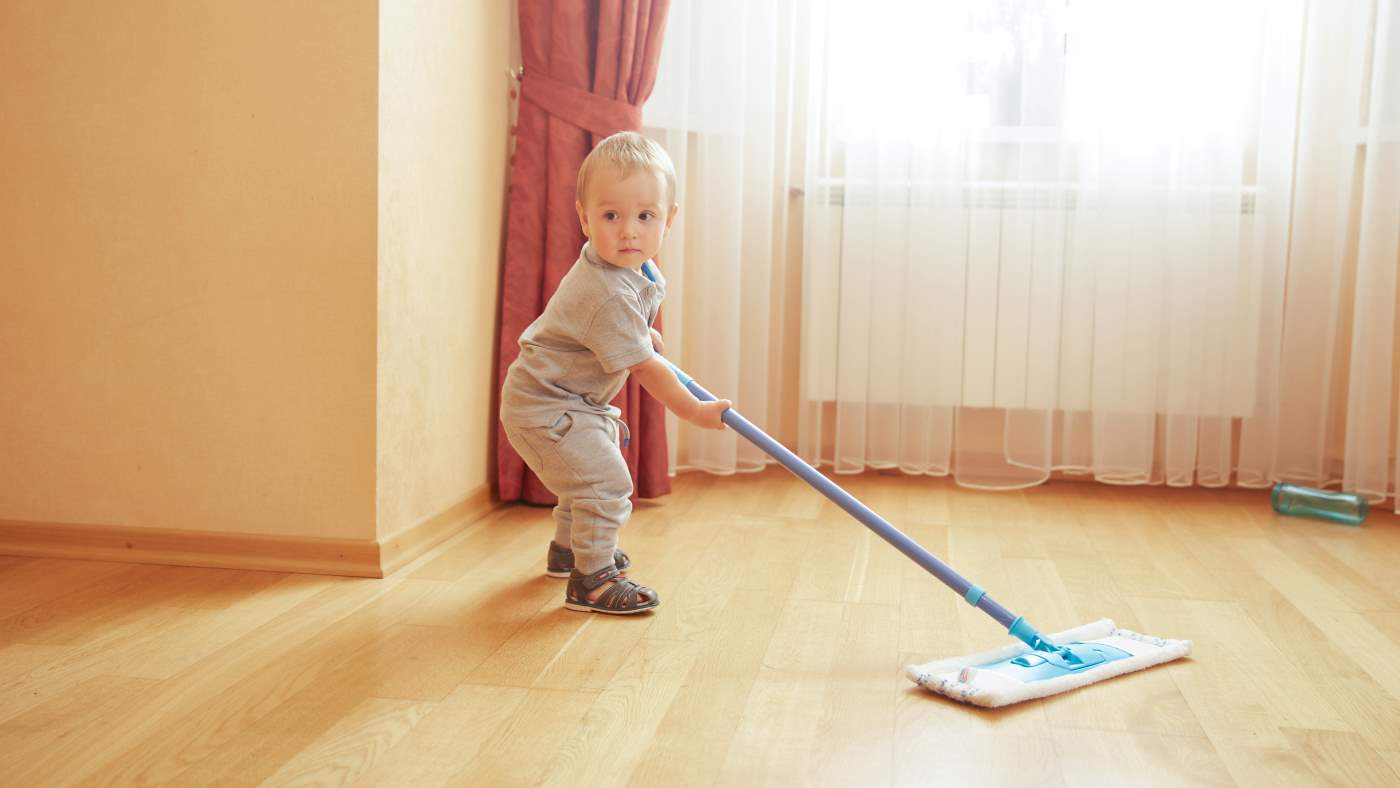 Get your toddler cleaning – it's fun and good for their gross motor development! - Featured Image