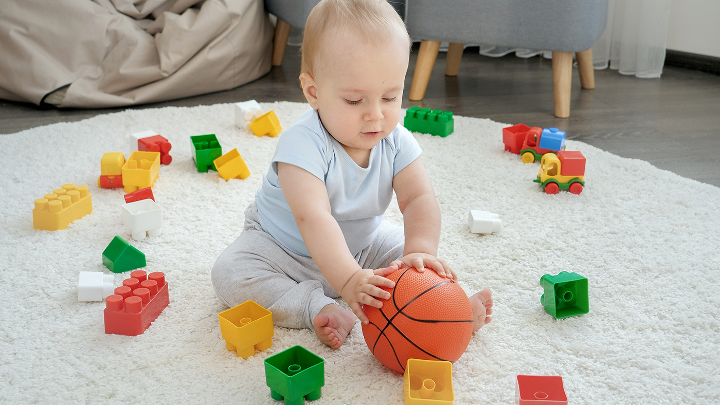 Here comes the ball – can your baby grab it as it rolls towards them? - Featured Image