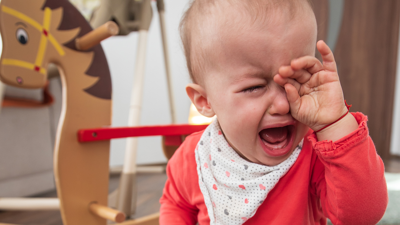 Cries or is unsettled when their nappy is dirty - Featured Image