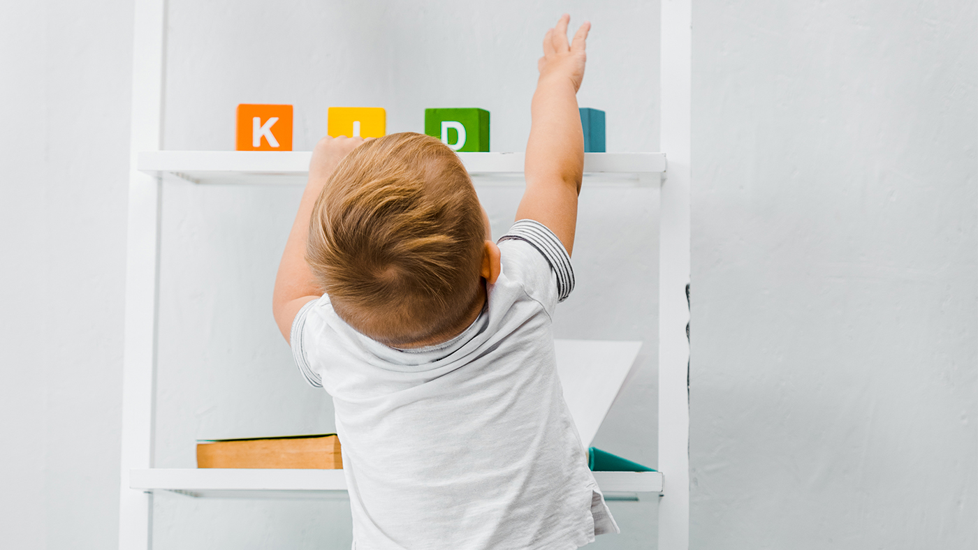 Encourage your toddler to stretch to reach their toys - Featured Image