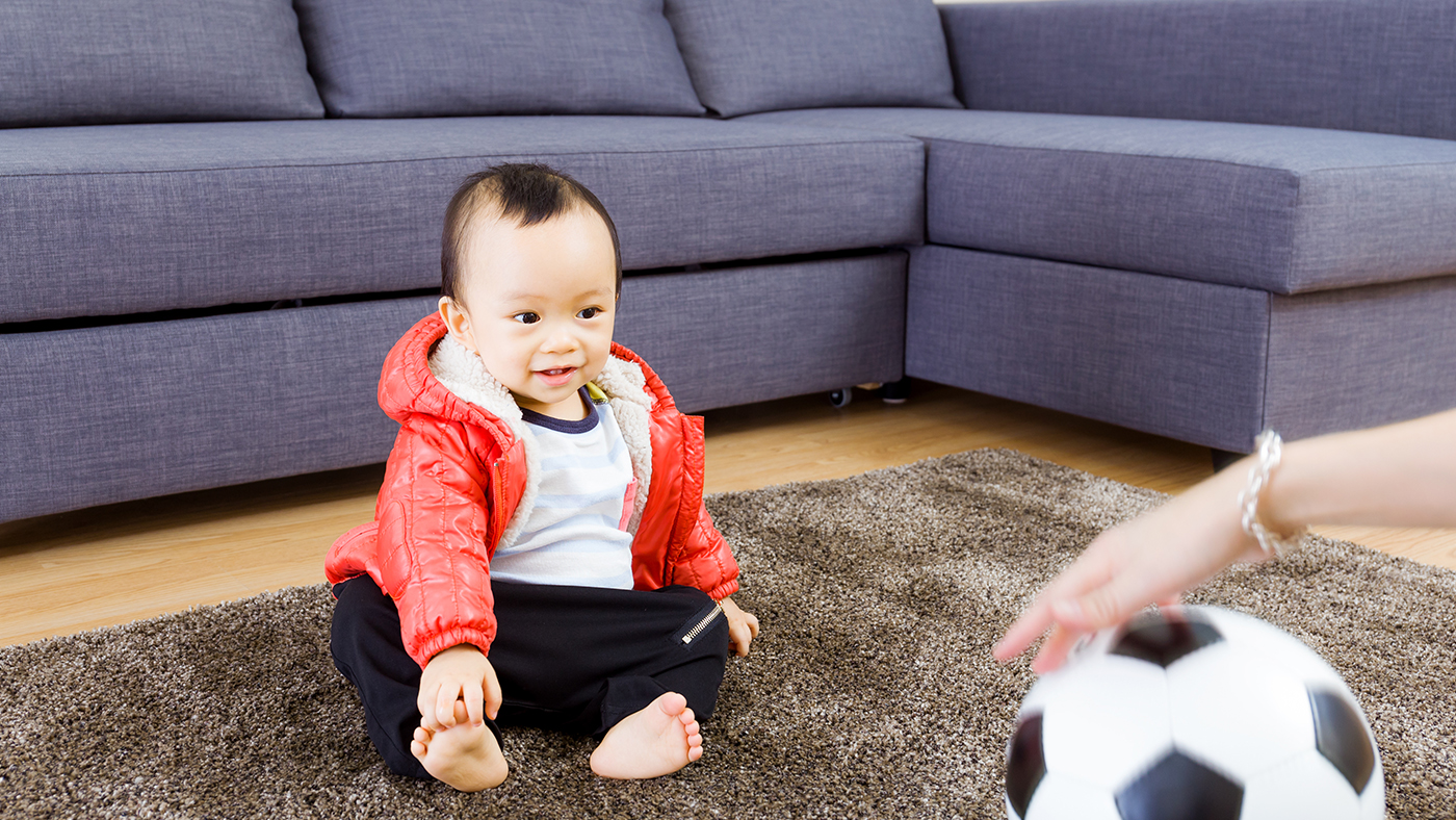 Roll the ball to me! Playing games to support your baby’s developing vision - Featured Image