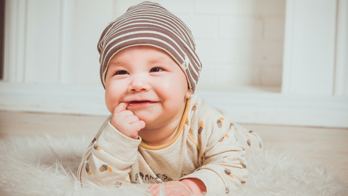 Hats on, hats off... over and over again! Playing peek-a-boo with a hat - Featured Image