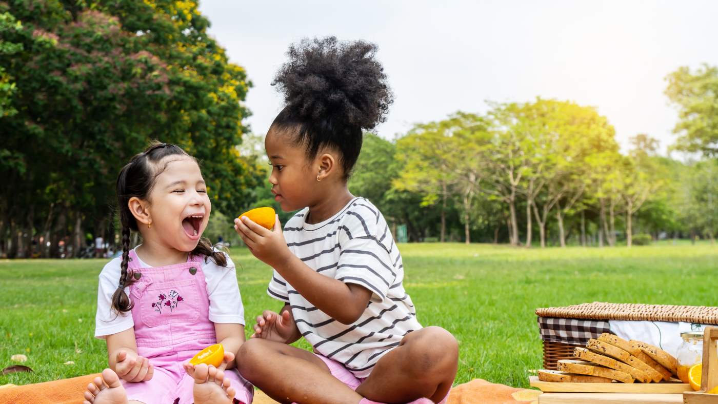 No snack bowl? No problem! Show your toddler how their cupped hand can be used to hold a snack - Featured Image